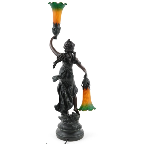 234 - After A Moreau, French style bronzed table lamp in the form of an Art Nouveau female with two orange... 