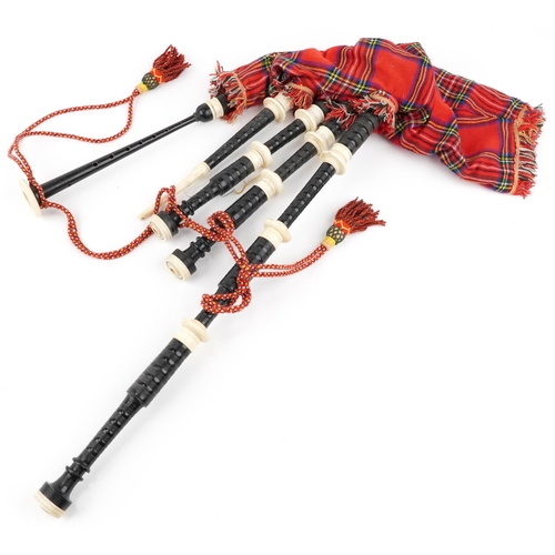 1247 - Set of Scottish interest bagpipes, various kilts and an as new sporran with stag's head