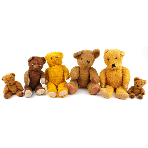 1527 - Six early 20th century and later teddy bears, some with straw filling, the largest 62cm high