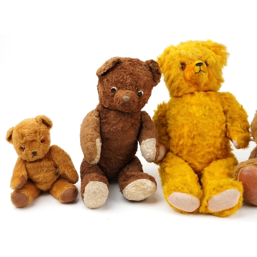 1527 - Six early 20th century and later teddy bears, some with straw filling, the largest 62cm high