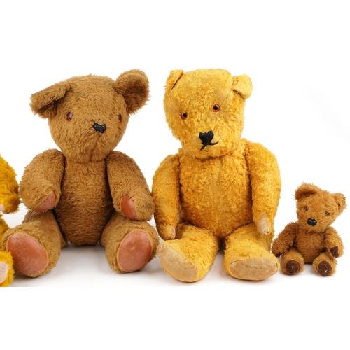 1527 - Six early 20th century and later teddy bears, some with straw filling, the largest 62cm high