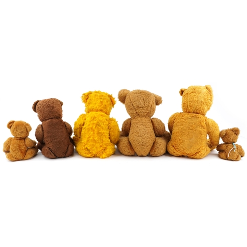 1527 - Six early 20th century and later teddy bears, some with straw filling, the largest 62cm high