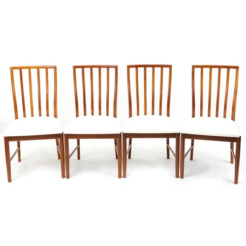 1073 - Mackintosh, mid century Scottish teak circular extending dining table with four chairs, the table 72... 