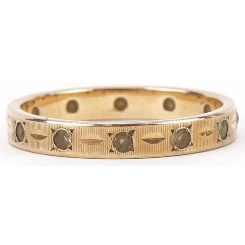 2397 - 9ct gold engine turned clear stone eternity ring, size L, 1.8g