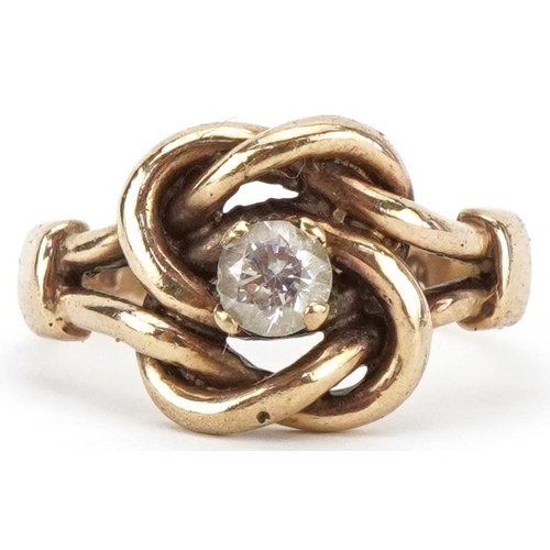 2370 - 9ct gold knot design ring set with a clear stone, size P, 5.2g