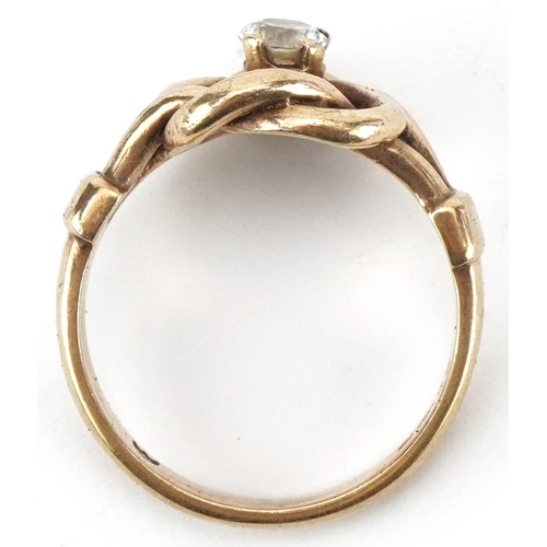 2370 - 9ct gold knot design ring set with a clear stone, size P, 5.2g