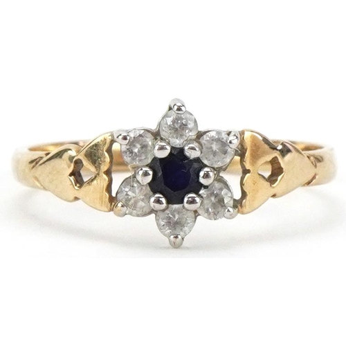 2164 - 9ct gold blue spinel and clear stone flower head ring with love heart design shoulders, size N, 1.4g