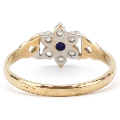 2164 - 9ct gold blue spinel and clear stone flower head ring with love heart design shoulders, size N, 1.4g