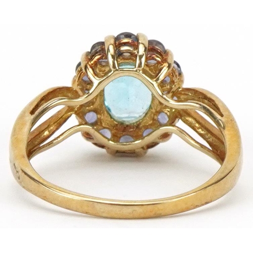 2072 - 9ct gold blue topaz and purple stone cluster ring with split shoulders, the topaz approximately 8.05... 