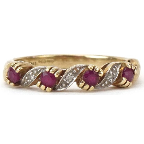 2216 - 9ct gold diamond and pink spinel half eternity crossover ring, size M, 2.1g