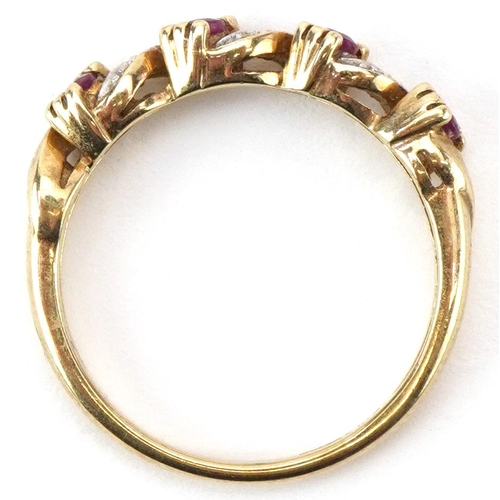 2216 - 9ct gold diamond and pink spinel half eternity crossover ring, size M, 2.1g