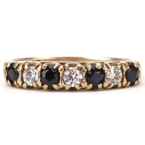 2407 - 9ct gold sapphire and clear stone half eternity ring, size O, 1.9g