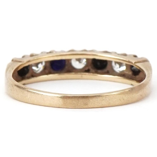 2407 - 9ct gold sapphire and clear stone half eternity ring, size O, 1.9g