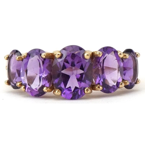 9ct gold graduated amethyst five stone ring, the largest amethyst approximately 8.0mm x 5.80mm x 4.20mm deep, size Q, 2.5g
