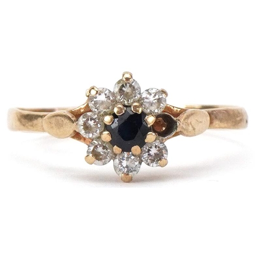 2440 - 9ct gold sapphire and clear stone flower head ring, size O/P, 1.3g