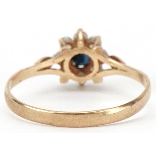 2440 - 9ct gold sapphire and clear stone flower head ring, size O/P, 1.3g