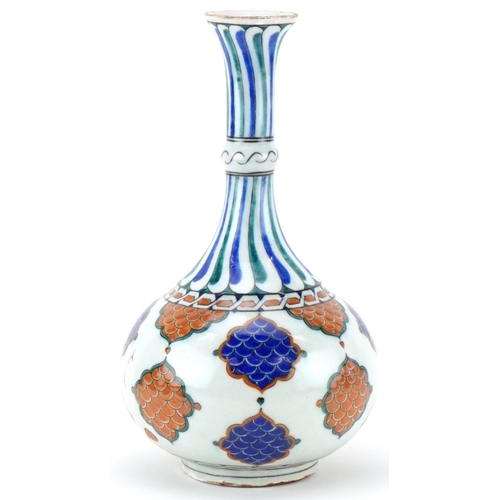 396 - Turkish Ottoman Iznik surahi hand painted with stylised leaves, 33cm high