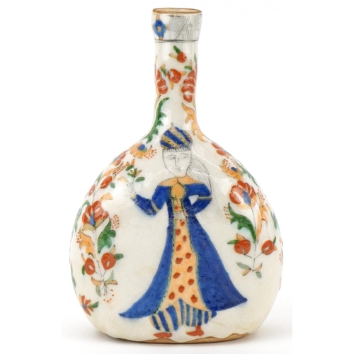 397 - Turkish Ottoman Kutahya water flask hand painted with figures amongst flowers, 22cm high