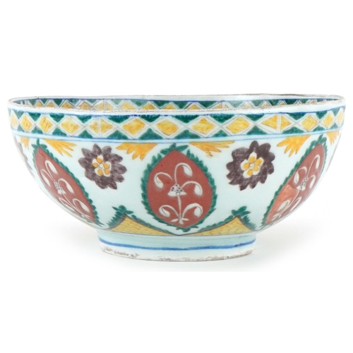 399 - Turkish Ottoman Kutahya bowl hand painted with stylised flowers and foliage, 21cm in diameter