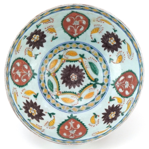 399 - Turkish Ottoman Kutahya bowl hand painted with stylised flowers and foliage, 21cm in diameter