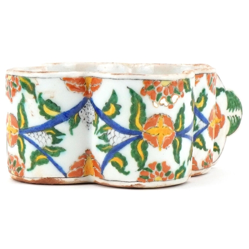 398 - Turkish Ottoman Armenian Kutahya cup hand painted with faces and stylised flowers, 15.5cm in length