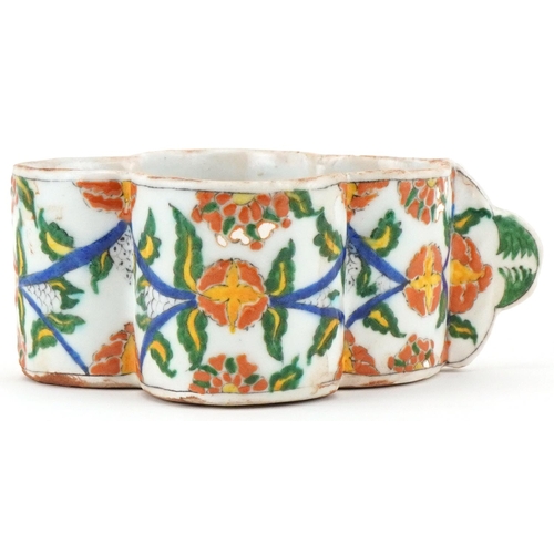 398 - Turkish Ottoman Armenian Kutahya cup hand painted with faces and stylised flowers, 15.5cm in length