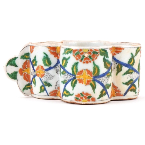 398 - Turkish Ottoman Armenian Kutahya cup hand painted with faces and stylised flowers, 15.5cm in length