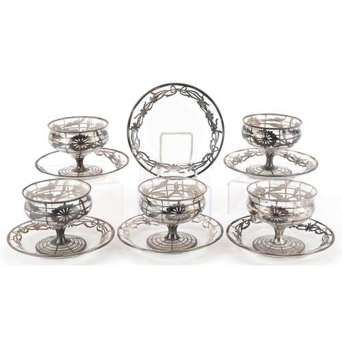 Early 20th century five American silver overlaid glass sundae dishes and saucers, the largest each 14cm in diameter