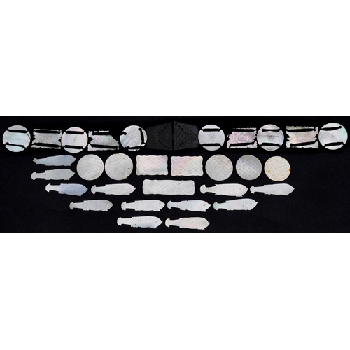 202 - Chinese Canton mother of pearl gaming counters, some arranged on a belt including examples of fish, ... 