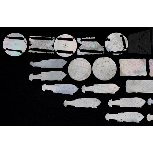 202 - Chinese Canton mother of pearl gaming counters, some arranged on a belt including examples of fish, ... 