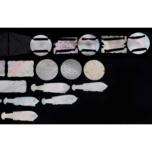 202 - Chinese Canton mother of pearl gaming counters, some arranged on a belt including examples of fish, ... 