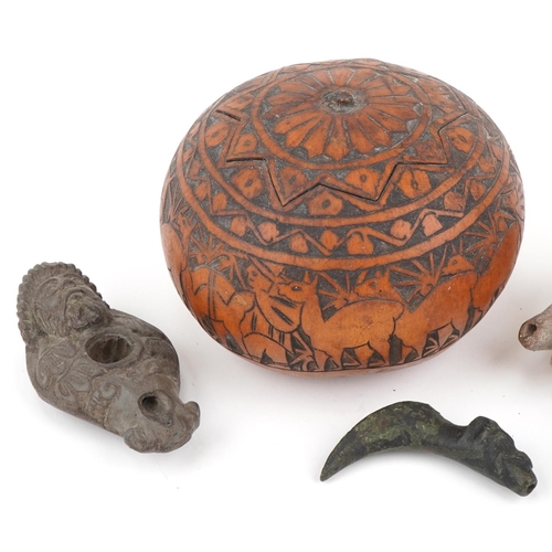 527 - Tribal artefacts including a zoomorphic bronze spout in the form of a dog's head, Peruvian folk art ... 