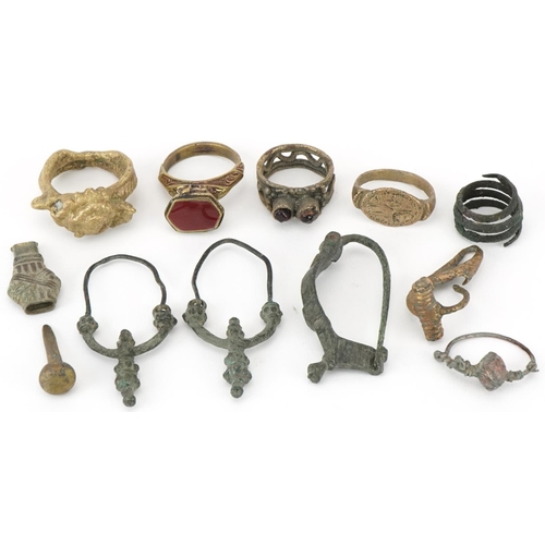 539 - Archeological interest Middle Eastern and ancient metal artefacts including a fibula brooch, possibl... 