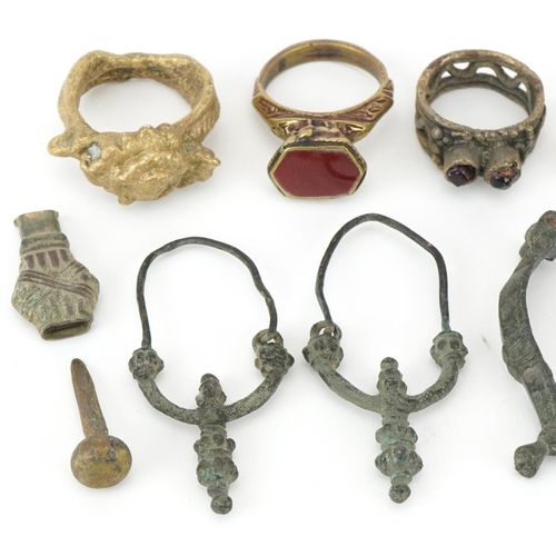 539 - Archeological interest Middle Eastern and ancient metal artefacts including a fibula brooch, possibl... 