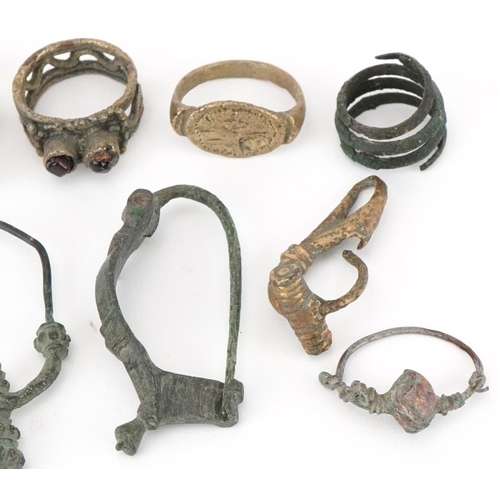 539 - Archeological interest Middle Eastern and ancient metal artefacts including a fibula brooch, possibl... 