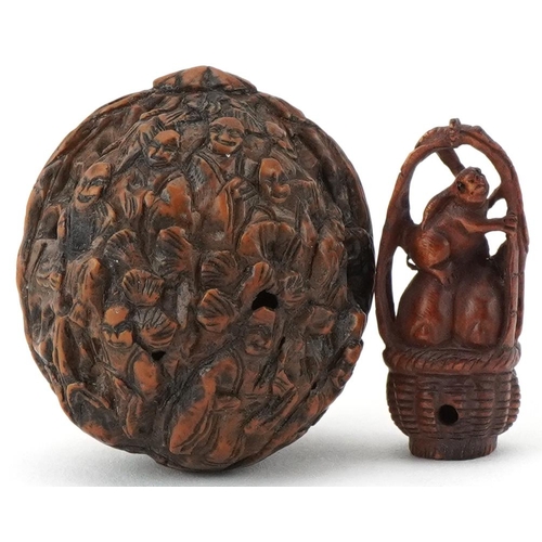 198 - Chinese walnut carved with figures and a Japanese boxwood netsuke carved with three rabbits in a bas... 