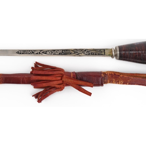 711 - Spanish bull fighting souvenir sword with leather sheath and Toledo blade, 68.5cm in length