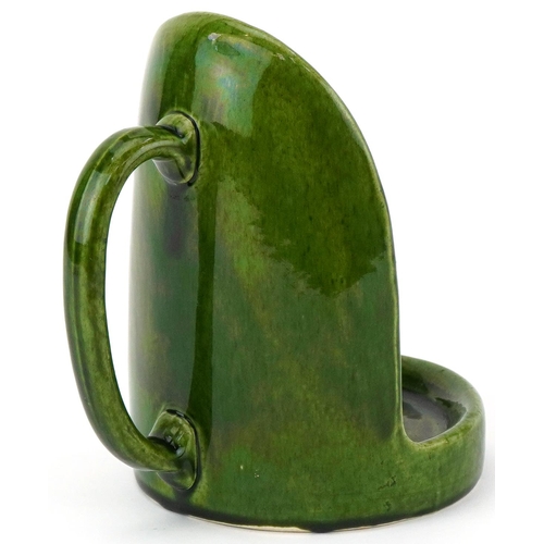 1418 - Arts & Crafts green glazed pottery chamberstick, 17.5cm high