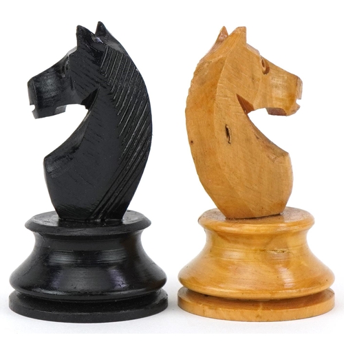 1501 - Boxwood and ebony Staunton pattern chess set housed in a pine case with slide lid, the largest piece... 