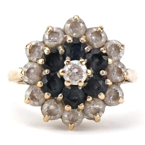 2458 - 9ct gold sapphire and clear stone three tier flower head ring, size L, 4.2g