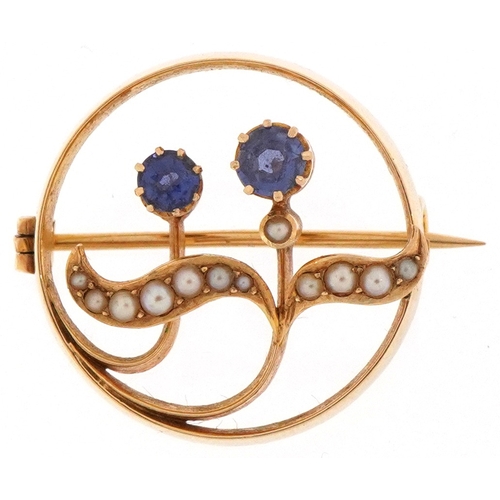 Art Nouveau 15ct gold sapphire and seed pearl floral brooch, 2.5cm in diameter, 6.0g