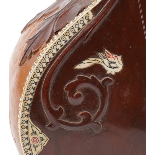 1242 - Indian hardwood, nut, ivorine and bone four string sitar, 126cm in length