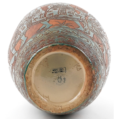 523 - Large mid century Vietnamese four handled vessel incised and hand painted with a continuous band of ... 