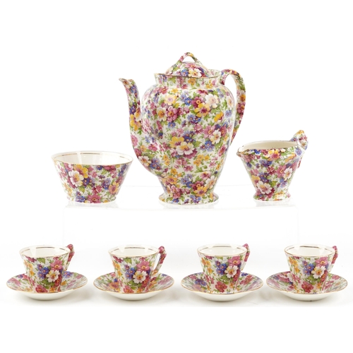 James Kent Fenton Du Barry chintz four place coffee service comprising coffee pot, milk jug, sugar bowl and four cups with saucers, the coffee pot 20cm high