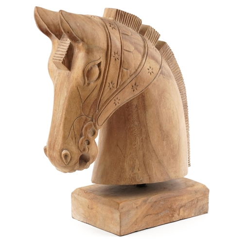 318 - Large lightwood carving of a horsehead on a rectangular block base, 54cm high