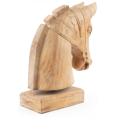 318 - Large lightwood carving of a horsehead on a rectangular block base, 54cm high