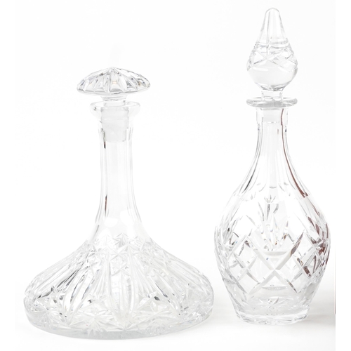 1188 - Six glass decanters including a pair housed in a hardwood tantalus with bronze mounts and silver pla... 