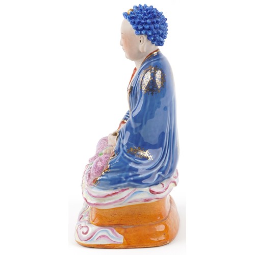 1320 - Chinese hand painted porcelain seated Buddha gilded with roundels of flowers, 31cm high