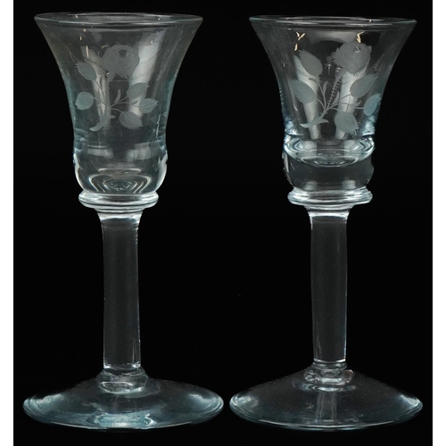 1421 - Near pair of wine glasses etched with Jacobite roses, each 15cm high