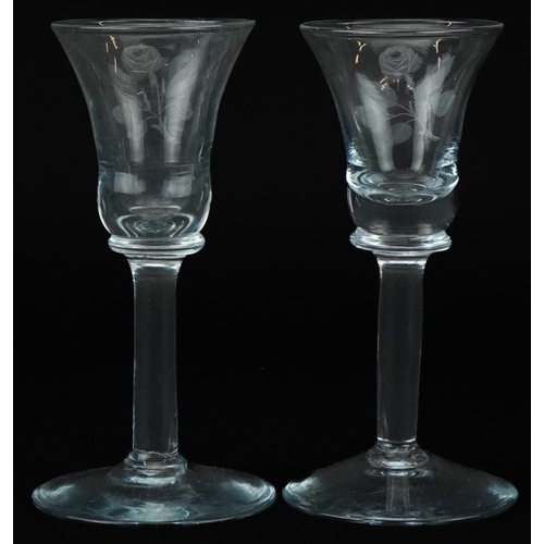 1421 - Near pair of wine glasses etched with Jacobite roses, each 15cm high